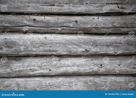 Rough Old Weathered Log Cabin Background Wall Closeup Stock Photo