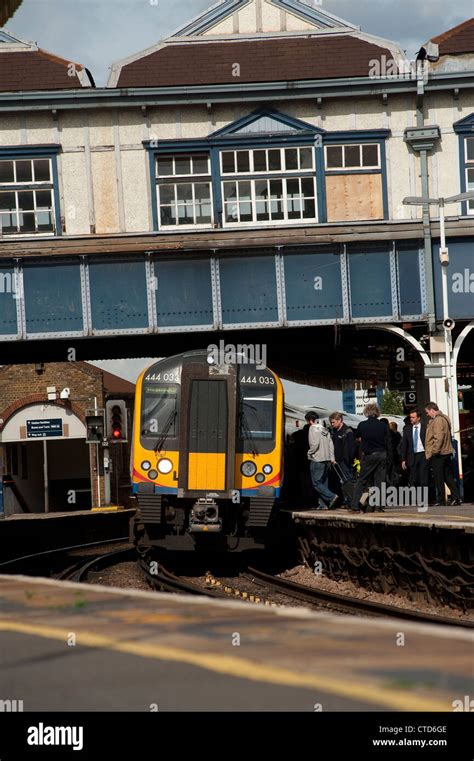 Passengers boarding a class 444 train in South West Trains livery at ...