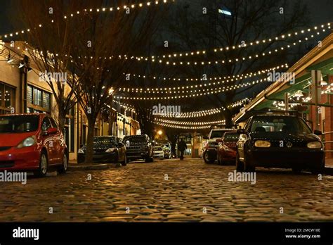 Cobblestone Street At Night In The City Market Business District In