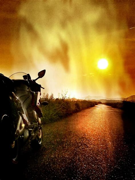 Motorcycle Riding Into Sunset