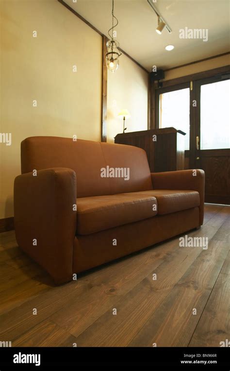 Brown leather sofa Stock Photo - Alamy