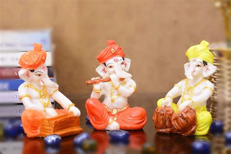 Buy Sn Handicrafts Idols Polyresine Set Of Orange Dhoti Turban