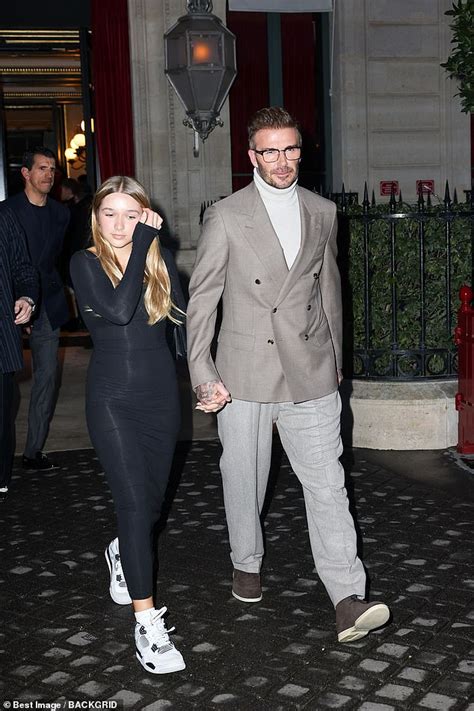 Harper Beckham looks chic in a black dress as she steps out hand-in ...