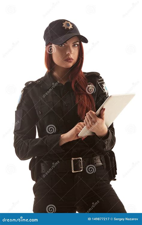 Redheaded Female Police Officer Is Posing For The Camera Isolated On