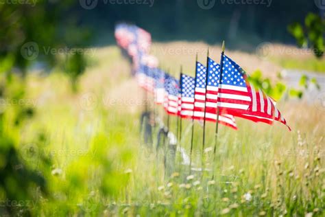 Row Of American Flags Waving In The Wind Along A Fence 22159802 Stock