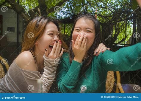 Young Happy And Cute Asian Chinese Girlfriends Taking Selfie Portrait