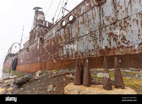 Old Rusty Whaling Ships And Processing Facilities At A Now Abandoned