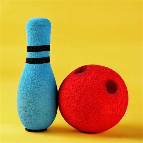 Premium Photo | Bright bowling pin and ball on color background