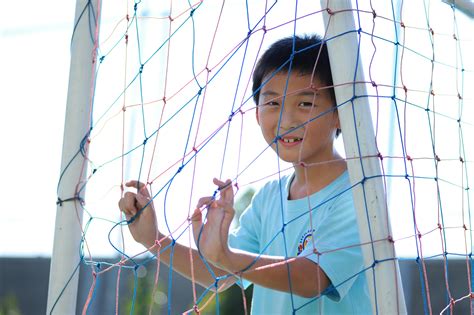 Photo of Kids Sitting in a Soccer Goal · Free Stock Photo