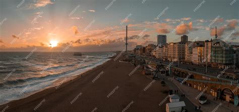 Premium Photo | Beautiful brighton beach view magical sunset and stormy ...