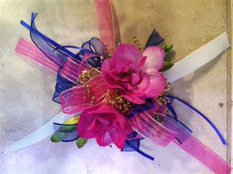 Wrist Corsage Made With Fragrant Freesia And Accented In Hot Pink