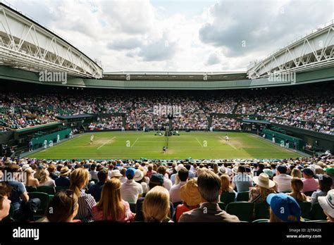 Jannik Sinner Of Italy And Carlos Alcaraz Of Spain On Centre Court During The Men’s Fourth Round