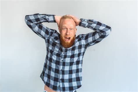 Freestyle Mature Man Standing Isolated On Grey Holding Head Looking