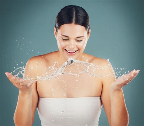 Premium Photo Water Splash Happy Woman And Washing Face For Skincare