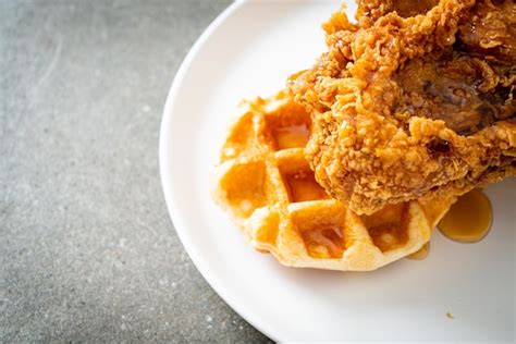 Premium Photo Fried Chicken Waffle With Honey Or Maple Syrup