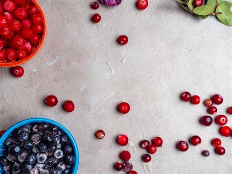 Premium Photo Frozen Blueberry Viburnum Cranberry In Bowls Decorated