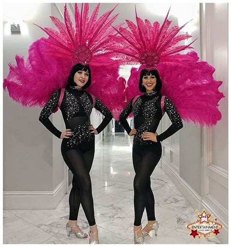 Black And Pink Showgirls Featuring A Rhinestone Bodysuit That Is