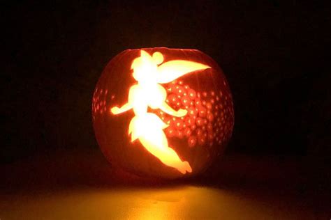 A Carved Pumpkin With An Image Of A Person On It