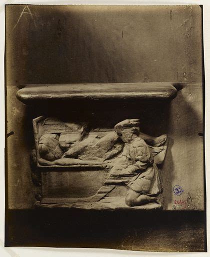 Bas Relief Of Mercy A Naked Woman Lying On A Bed In Front Of Free