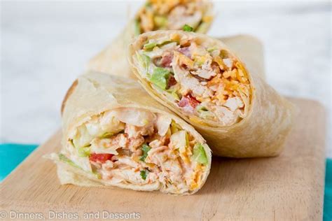 A Close Up Of Food On A Table With Chicken And Wrap Chicken Wrap