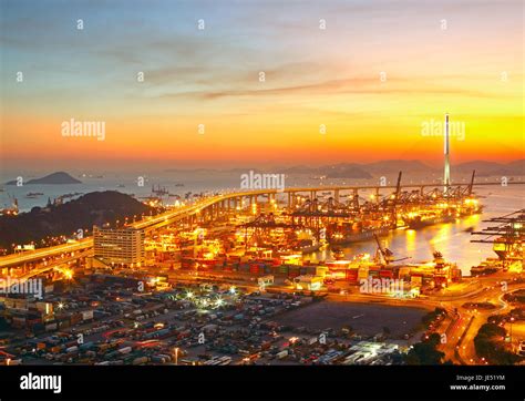 Port Warehouse With Cargoes And Containers At Sunset Stock Photo Alamy