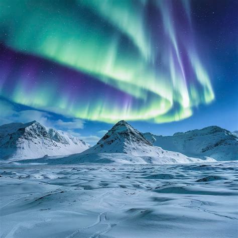 Premium Photo | Nature background northern lights over snowy Greenland