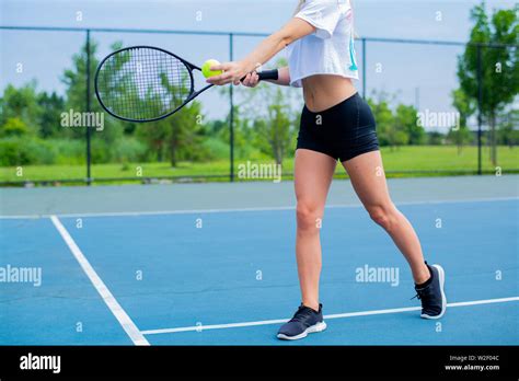 Beautiful Woman With Tennis Racket Playing Tennis On Blue Court Stock