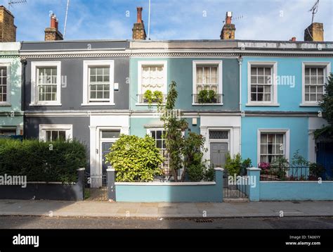 Colourful Traditional British Terraced Houses With Front Gardens And