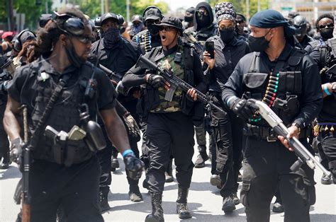 Armed black protesters march in US demanding justice for Breonna Taylor ...