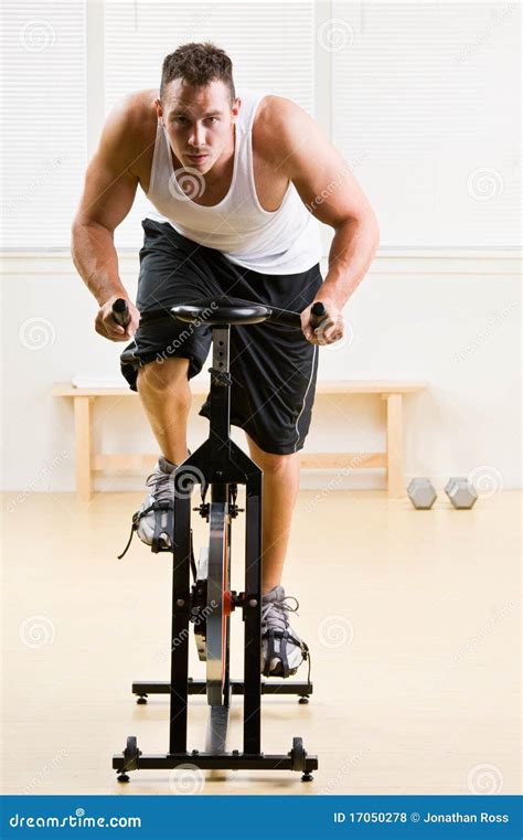 Man Riding Stationary Bicycle In Health Club Stock Photo Image 17050278