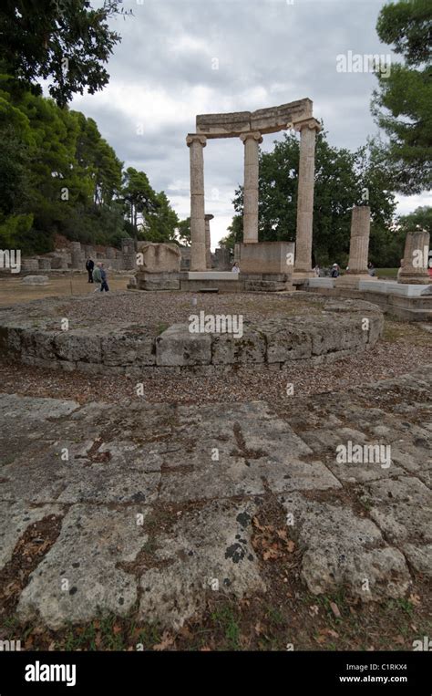 Tourists view the ancient Olympic ruins near the city of Olympia ...