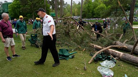 The Masters: Large trees fall at Augusta National as storms suspend play Friday | CNN