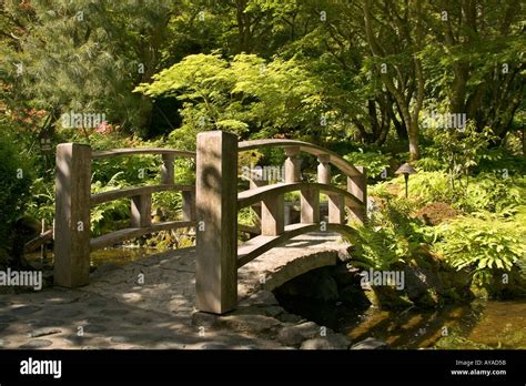 stone path and bridge in Japanese garden at Butchart Gardens in Victoria British Columbia Stock ...