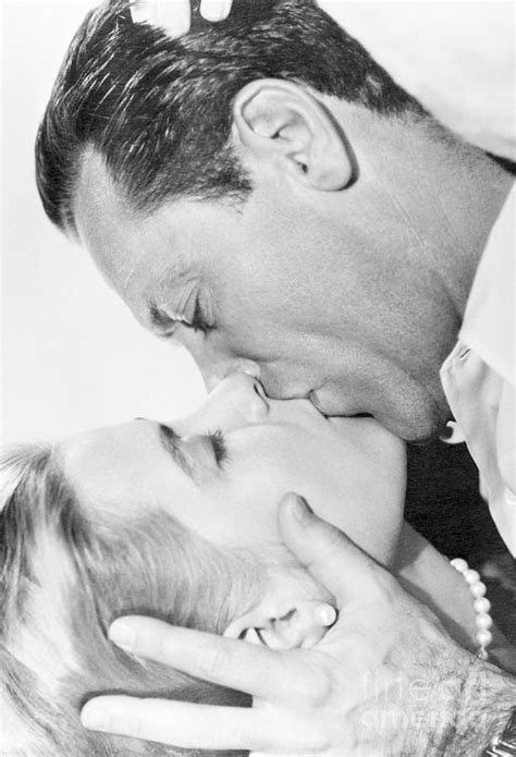 Grace Kelly Kissing William Holden By Bettmann