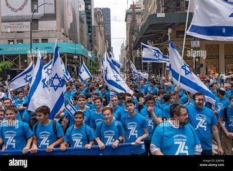 New York New York May 22 Participants Holding Israeli Flags And Signs March Up Fifth Avenue