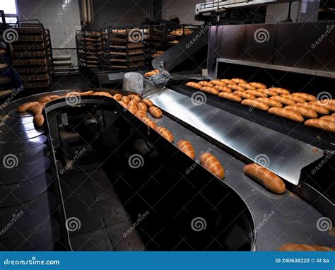 Conveyor Belt With Freshly Baked Bread Production At The Bakery Stock