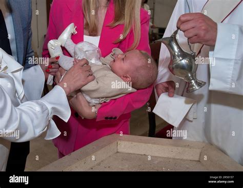 Baptism Ceremony In Catholic Church Stock Photo Alamy