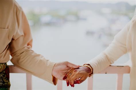 Premium Photo | Wedding couple holding hands.