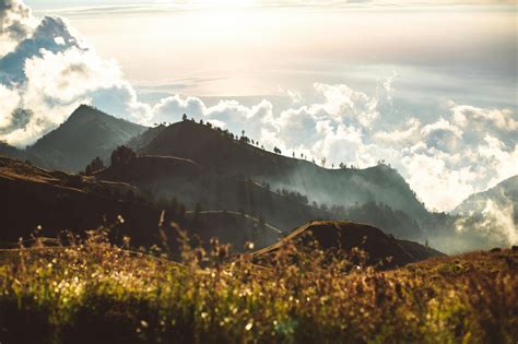 Hills In Bright Sunshine And Clouds At Sunset · Free Stock Photo