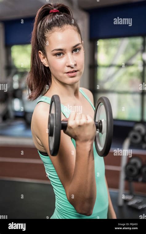 Woman Lifting Dumbbell Stock Photo Alamy