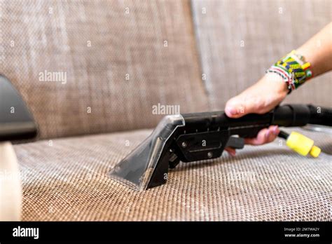 Professional steam cleaner. Sofa cleaning Stock Photo - Alamy