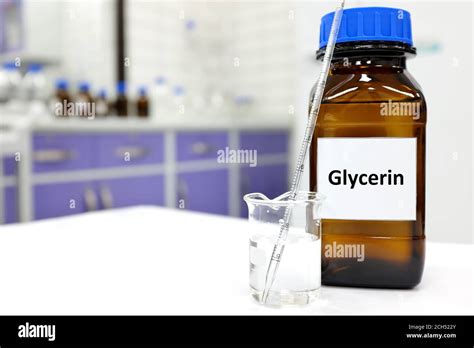 Selective Focus Of Glycerin Glass Bottle In A White Laboratory Background With Copy Space Stock