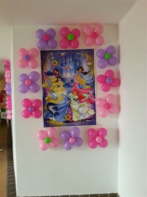 Some Balloons Are Hanging On The Wall In Front Of A Painting With