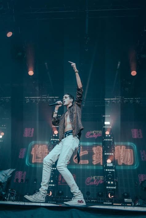 Free Stock Photo Of Man Standing On Top Of Stage Holding Microphone