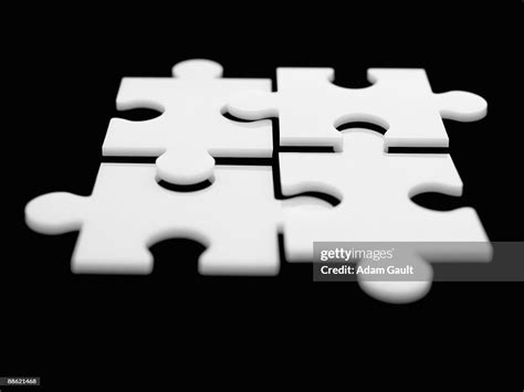 Four Interlocking Puzzle Pieces High Res Stock Photo Getty Images