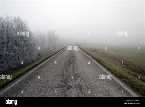 Poor Visibility During Winter Country Road Disappearing In A Thick