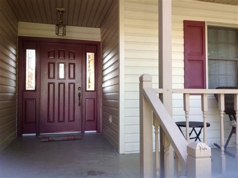 Tan Siding With Wood Shutters A Perfect Match For Your Homes Exterior