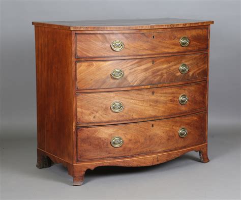 A George Iii Mahogany Bowfront Chest Of Oak Lined Drawers The Top With