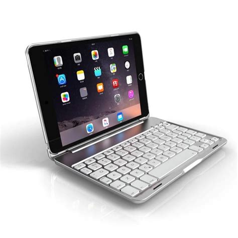 an ipad with a keyboard attached to the back cover is shown in this ...