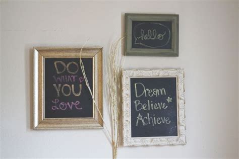 two framed chalkboard signs on the wall